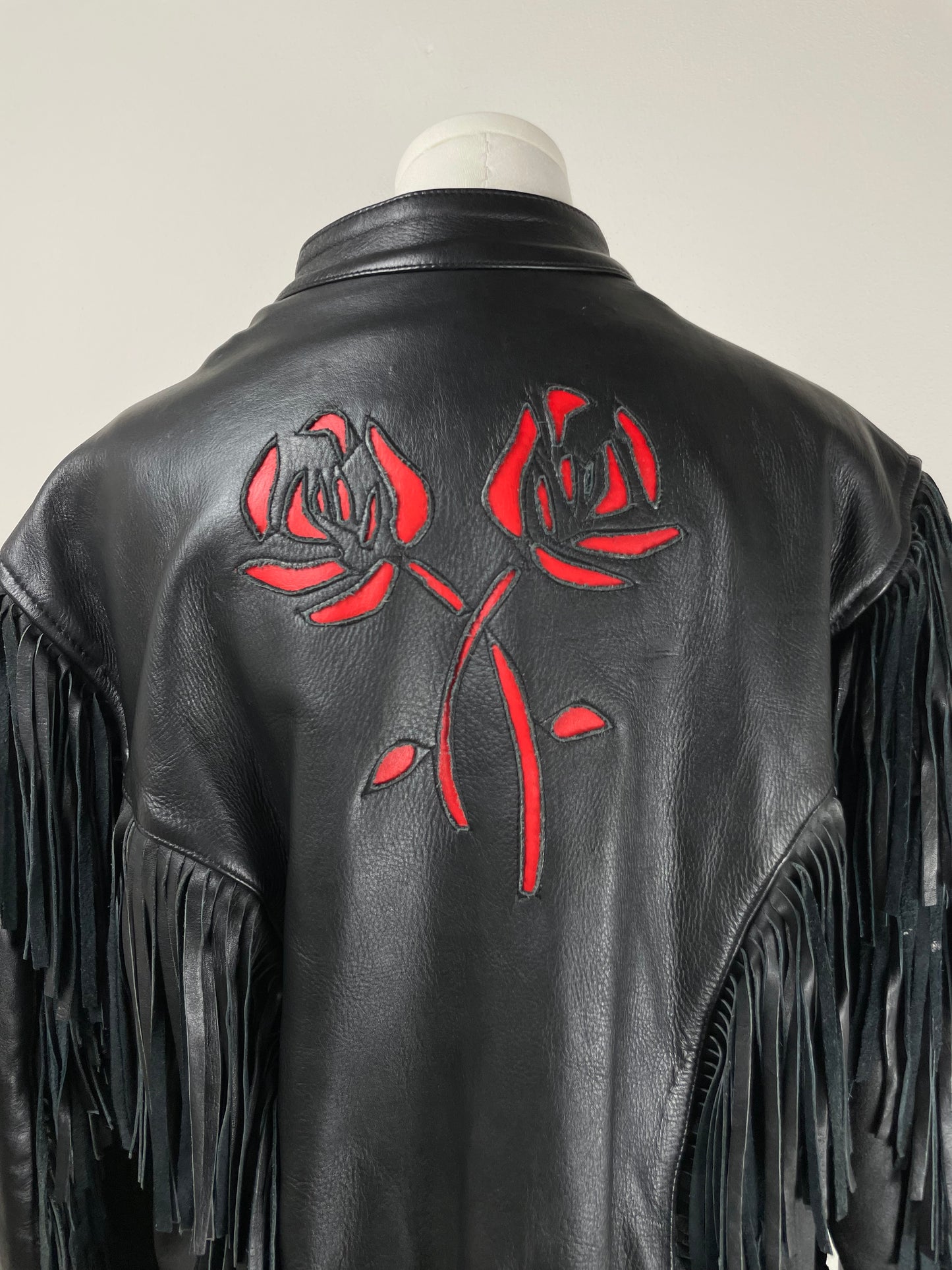 Chiodo vintage in pelle con frange e rose
