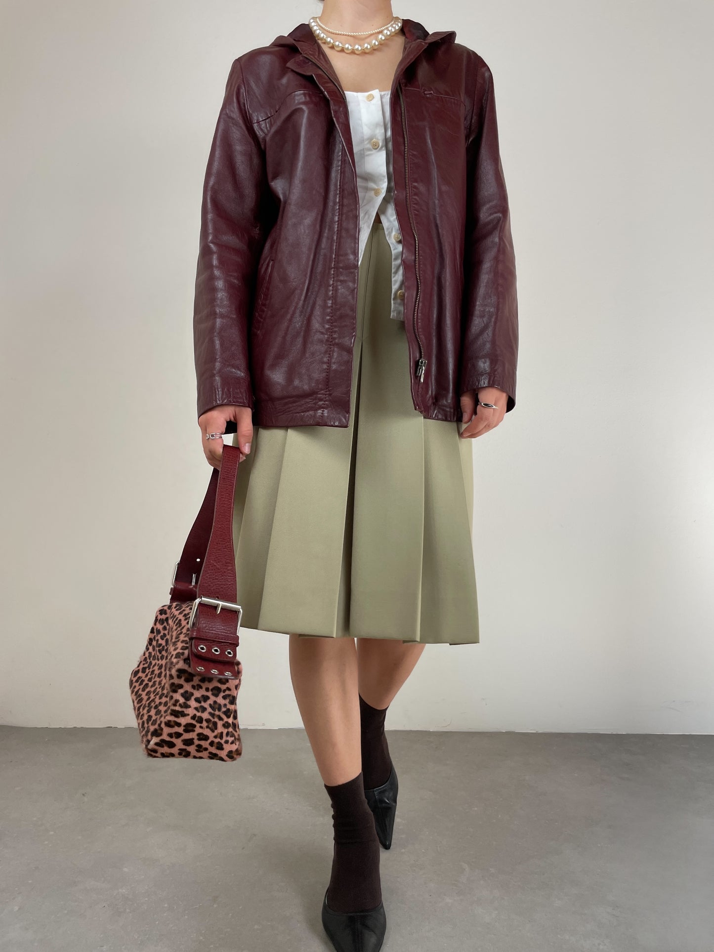 Gonna sartoriale a pieghe in lana color pistacchio