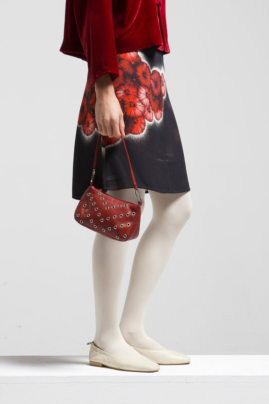 Borsetta in vera pelle bordeaux con occhielli