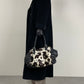 Borsa in vera pelle con il davanti in cavallino cow print