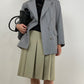 Gonna sartoriale a pieghe in lana color pistacchio