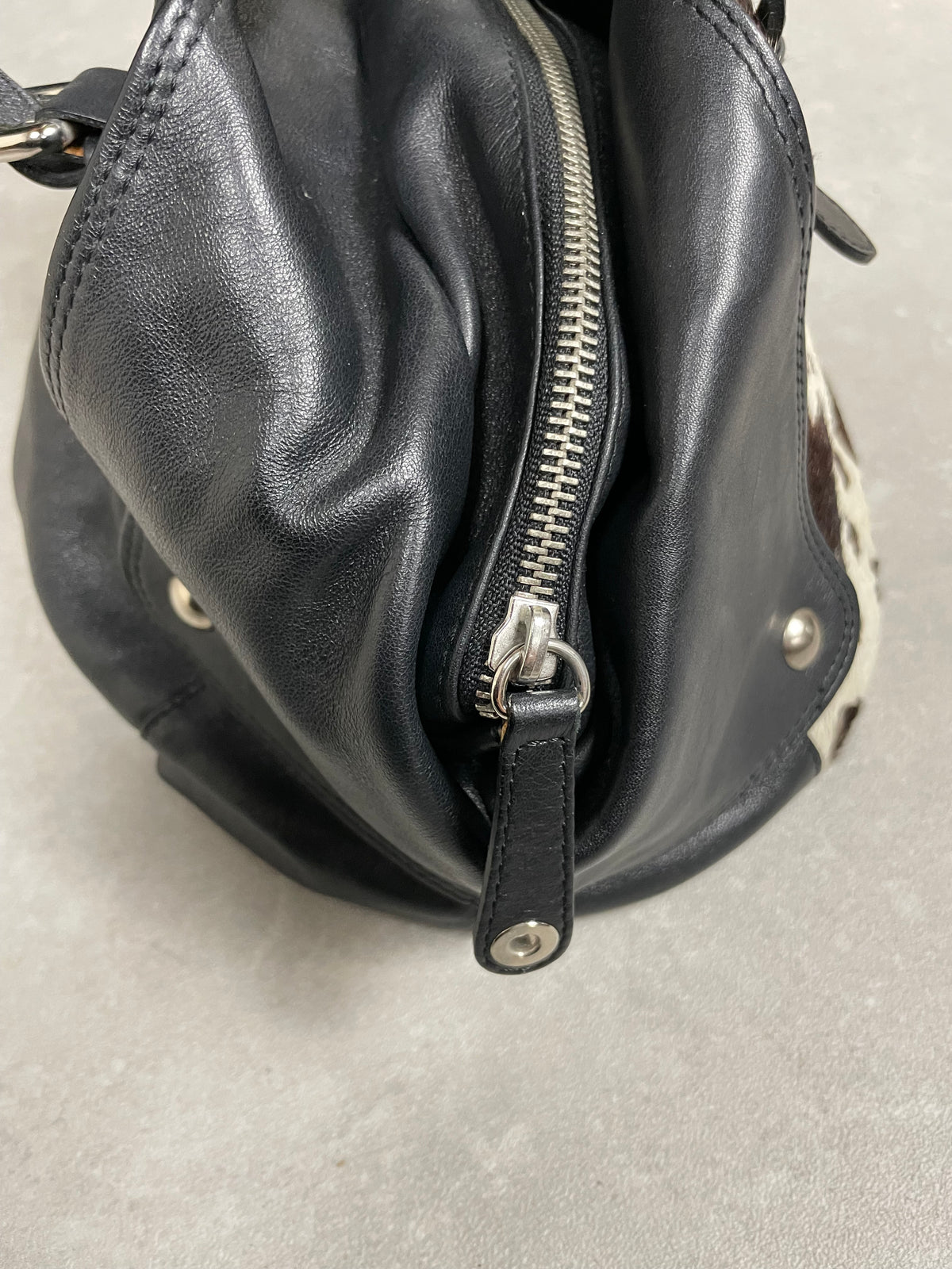 Borsa in vera pelle con il davanti in cavallino cow print