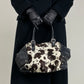 Borsa in vera pelle con il davanti in cavallino cow print