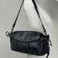 Borsa baguette in pelle nera con manico intrecciato