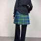Gonna a pieghe in fantasia tartan con alamari