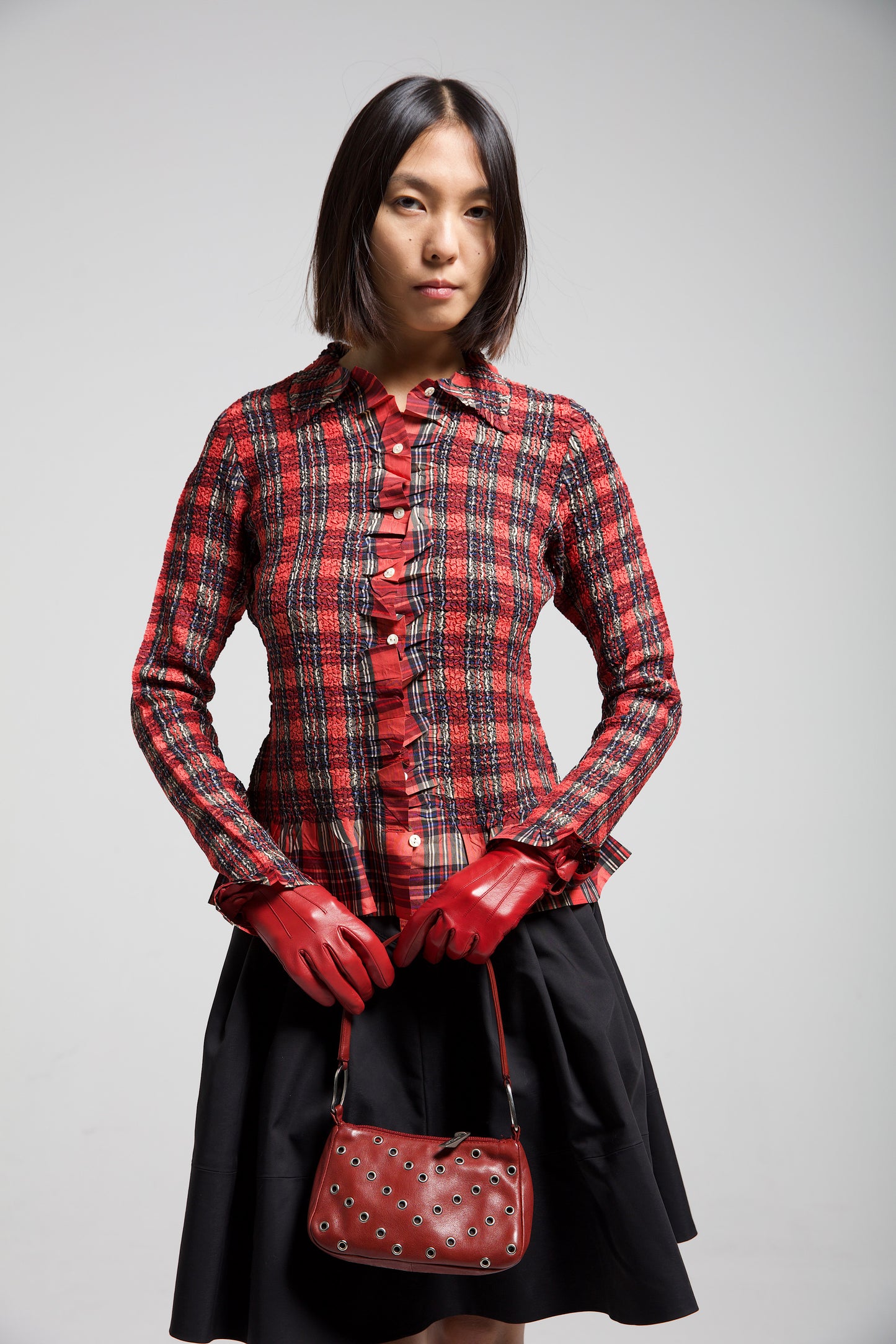 Borsetta in vera pelle bordeaux con occhielli