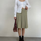 Gonna sartoriale a pieghe in lana color pistacchio