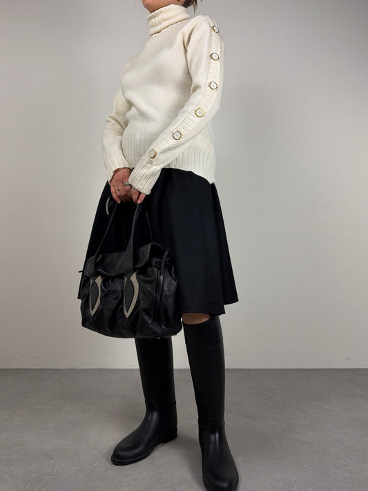 Maglione in pura lana con abbottonatura sulla manica