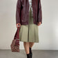 Gonna sartoriale a pieghe in lana color pistacchio