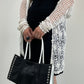 Cardigan all’uncinetto con motivo floreale