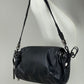 Borsa baguette in pelle nera con manico intrecciato