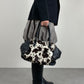 Borsa in vera pelle con il davanti in cavallino cow print