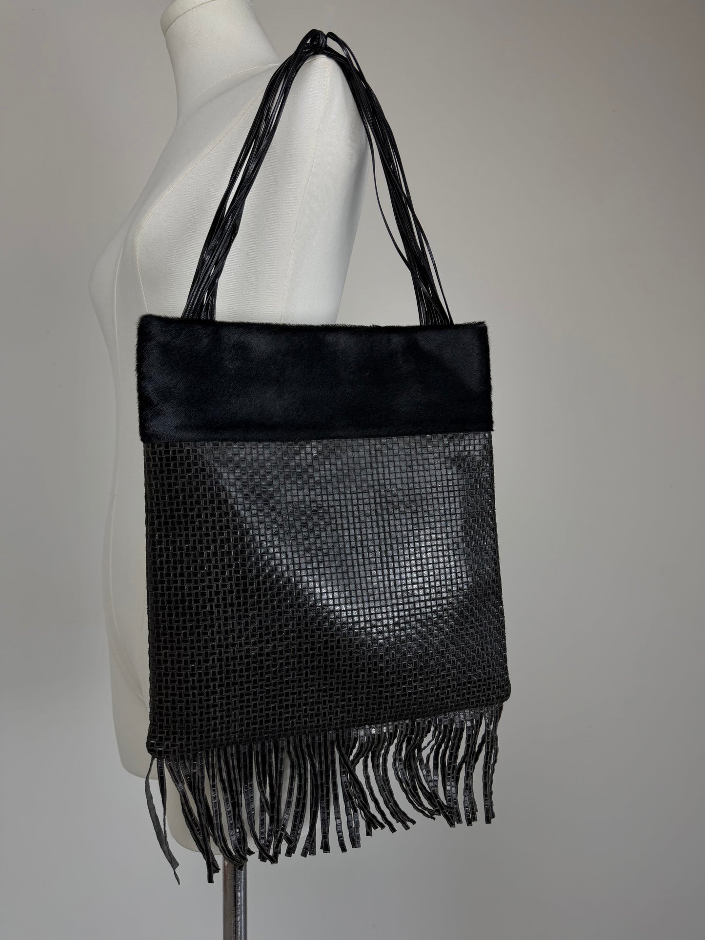 Borsa in vera pelle intrecciata con inserto in cavallino