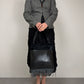 Borsa in vera pelle intrecciata con inserto in cavallino