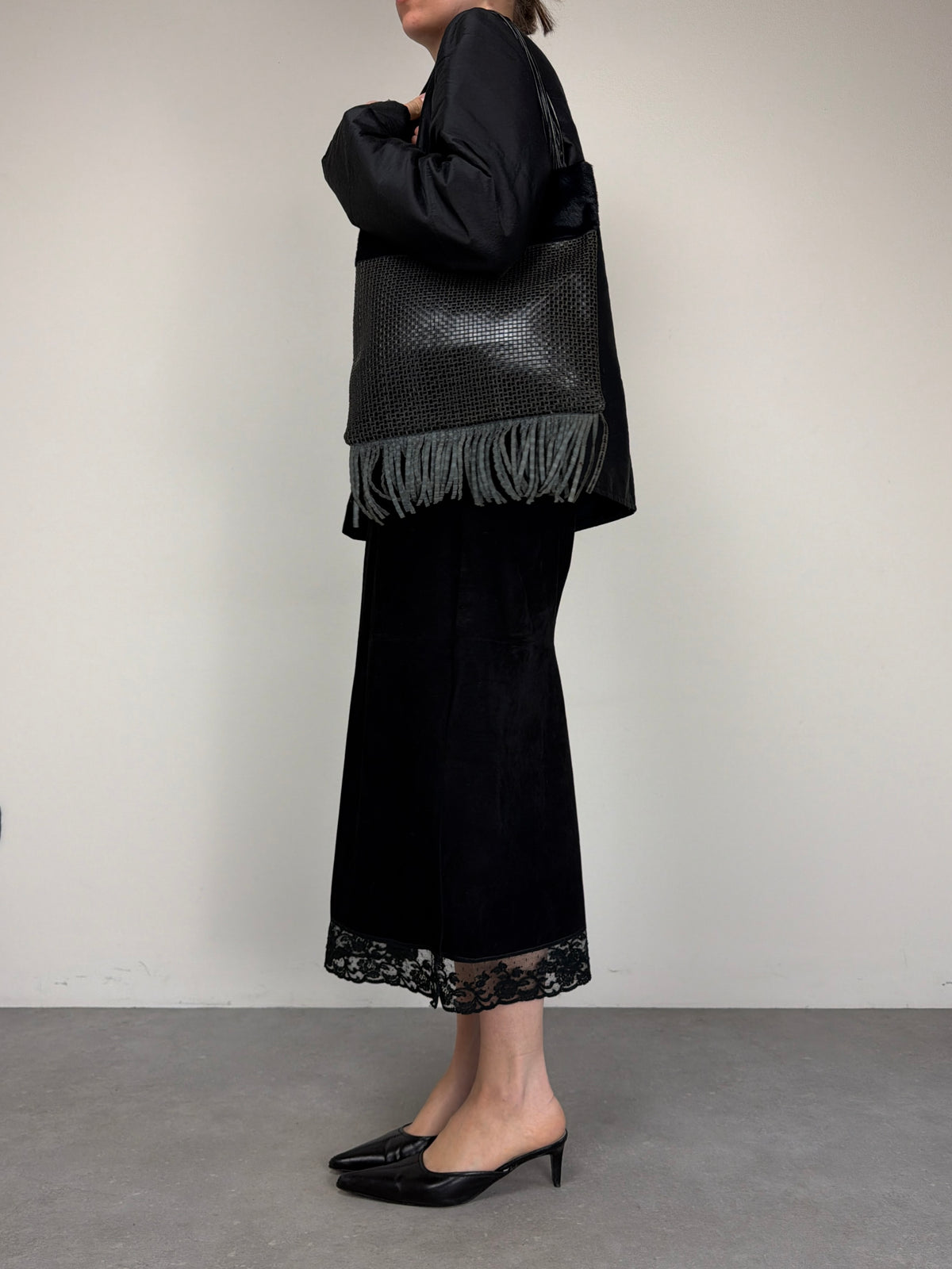 Borsa in vera pelle intrecciata con inserto in cavallino
