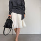 Blusa in pura seta grigia con drappeggio