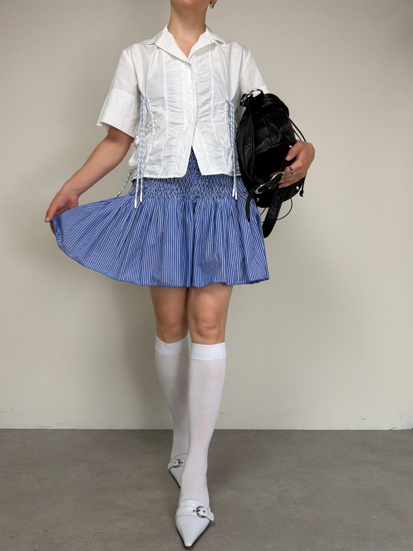Gonna in cotone a righe con punto smock