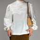 Blusa in seta ricamata a mano