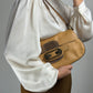 Borsa in vera pelle con dettagli in metallo